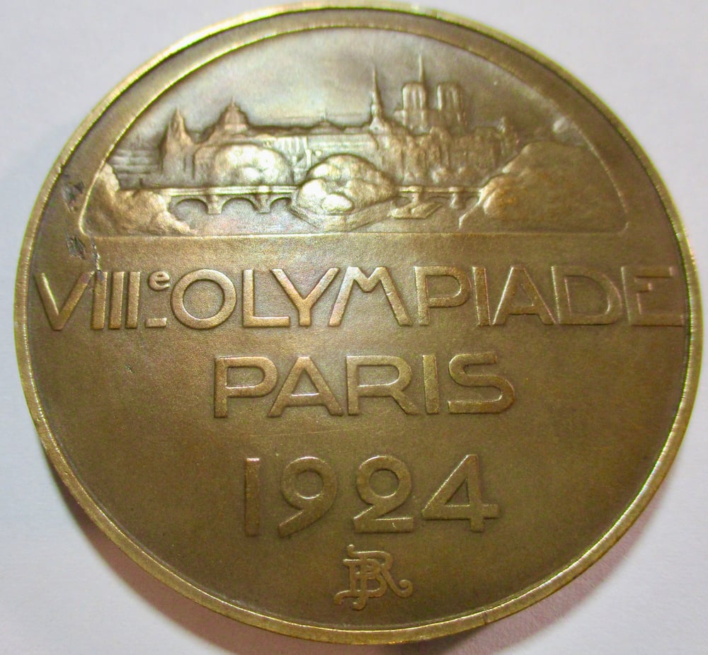 A MEDAL TO GO WITH TICKETS FROM THE OLYMPICS....PLEASE READ THE DESCRIPTION