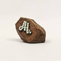 Al. Lettering on Rock