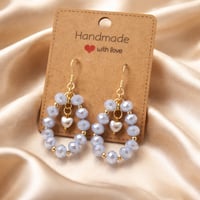 LIGHT BLUE BEADS  WITH A PEARL HEART DANGLE