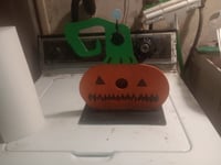 Image 1 of jack o'lantern seesaw spinner and bell