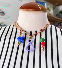 Portaamores y/o collar regulable malva  de Domingo Ayala 