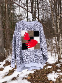 Image 1 of Quilt Block Sweatshirt: hand holding fire