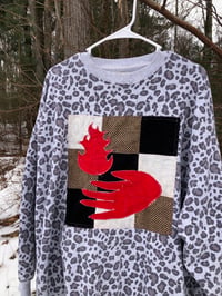 Image 3 of Quilt Block Sweatshirt: hand holding fire