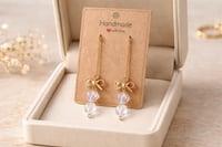 IRIDESCENT HEARTS WITH GOLD BOW DANGLE ON A LONG GOLD CHAIN