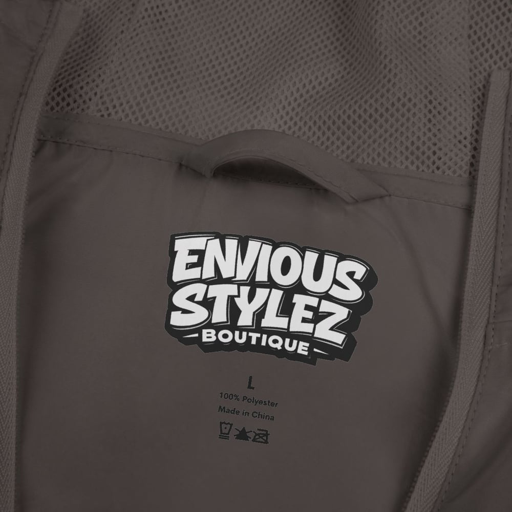 Image of Unisex Windbreaker Jacket — "Not Luck Not Random Chosen" Graphic Hooded Windbreaker