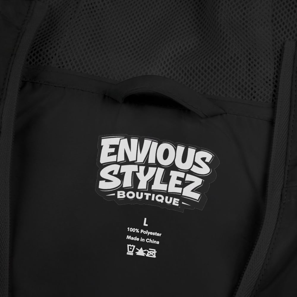 Image of Unisex Windbreaker Jacket — "Not Luck Not Random Chosen" Graphic Hooded Windbreaker