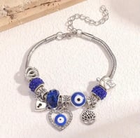 A Silver Heart/Eye Charm Bracelet 
