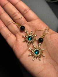 Green sun earrings 