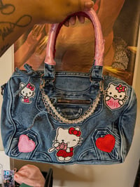 Image 1 of Hello kitty themed junk purse 