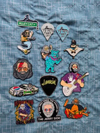Choose a Jerry Garcia Pin. Comes with 10 GD stickers.