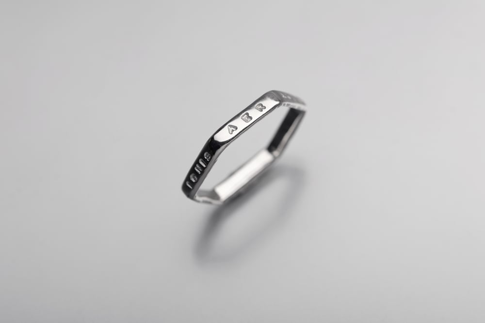 Image of Silver light hexagon ring with inscription in Latin