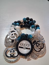 Image 1 of Gucc in black out
