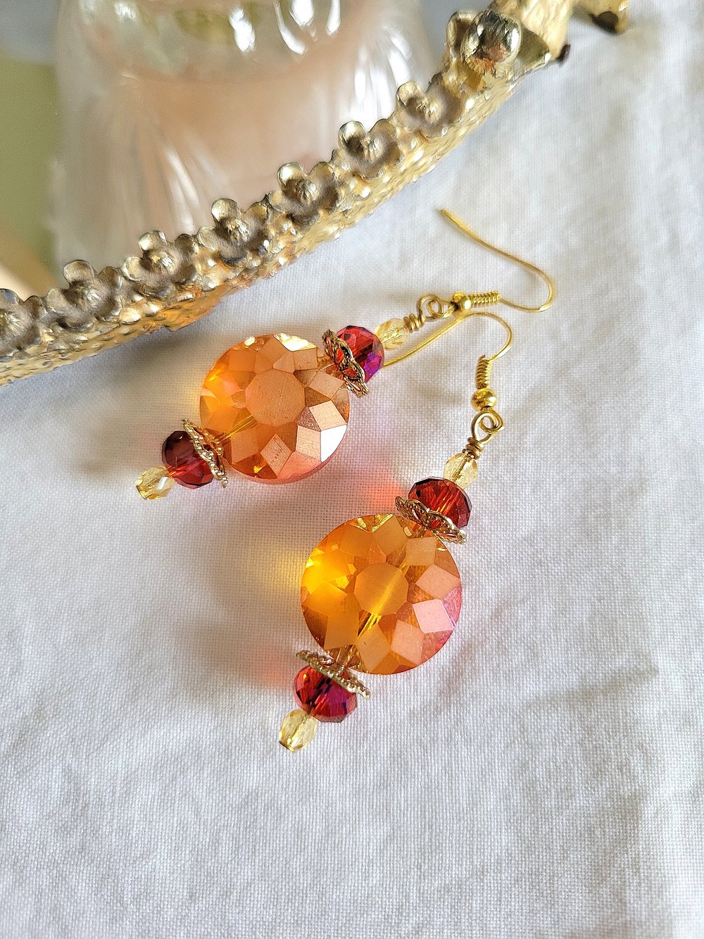 Image of ​Orange Disc Earrings with a Sunburst Pattern
