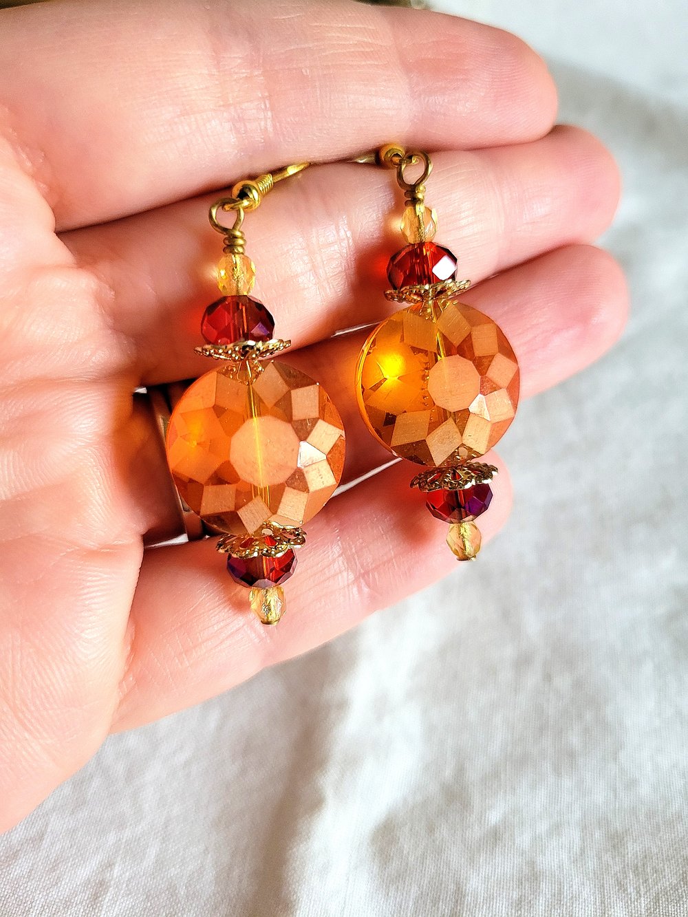 Image of ​Orange Disc Earrings with a Sunburst Pattern