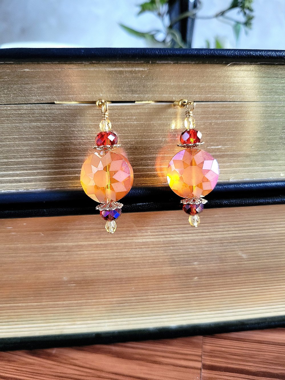 Image of ​Orange Disc Earrings with a Sunburst Pattern