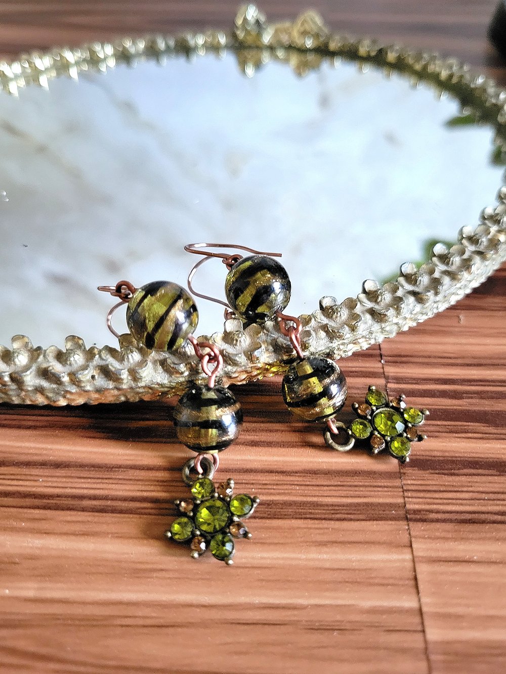 Image of Black Swirl Beaded Earrings with Peridot Flower Charm