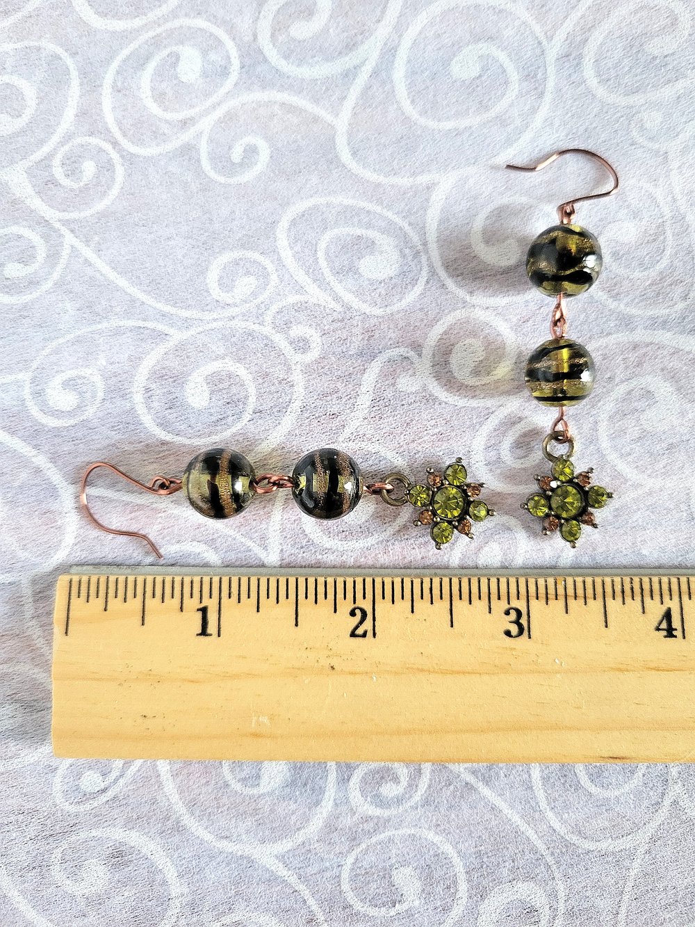 Image of Black Swirl Beaded Earrings with Peridot Flower Charm