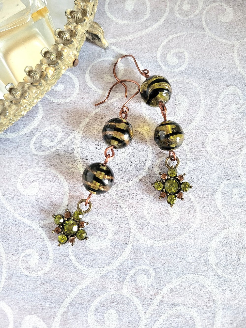Image of Black Swirl Beaded Earrings with Peridot Flower Charm