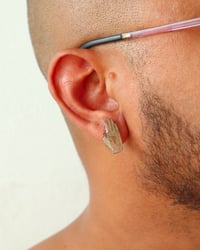 Image 1 of Studs | Manos 1