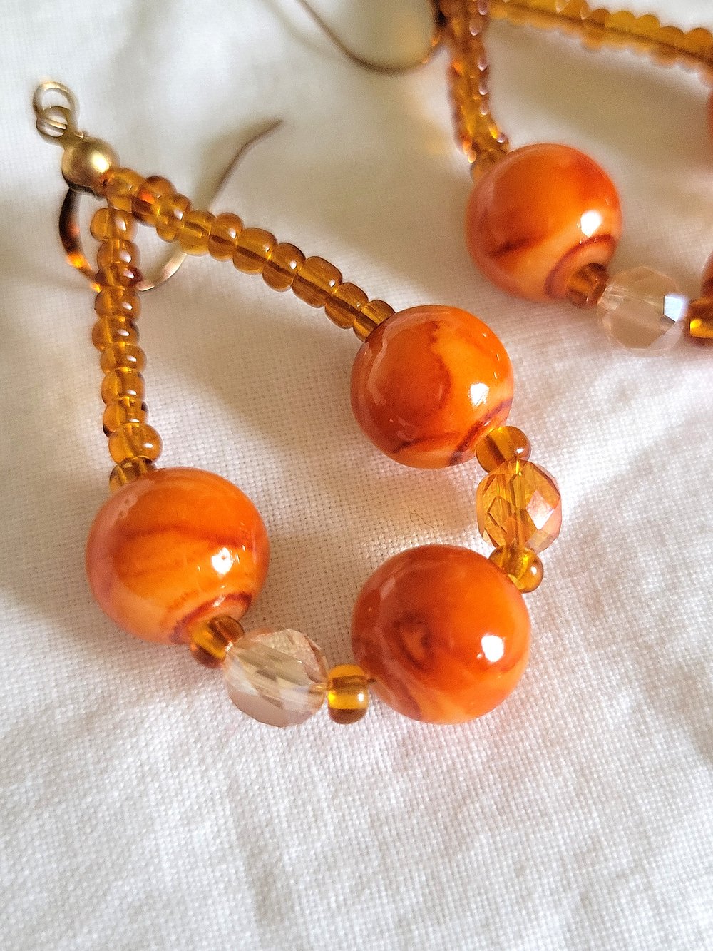 Image of Orange Marble Beaded Teardrop Hoop Earrings