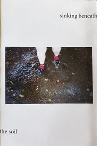 Image 1 of sinking beneath the soil