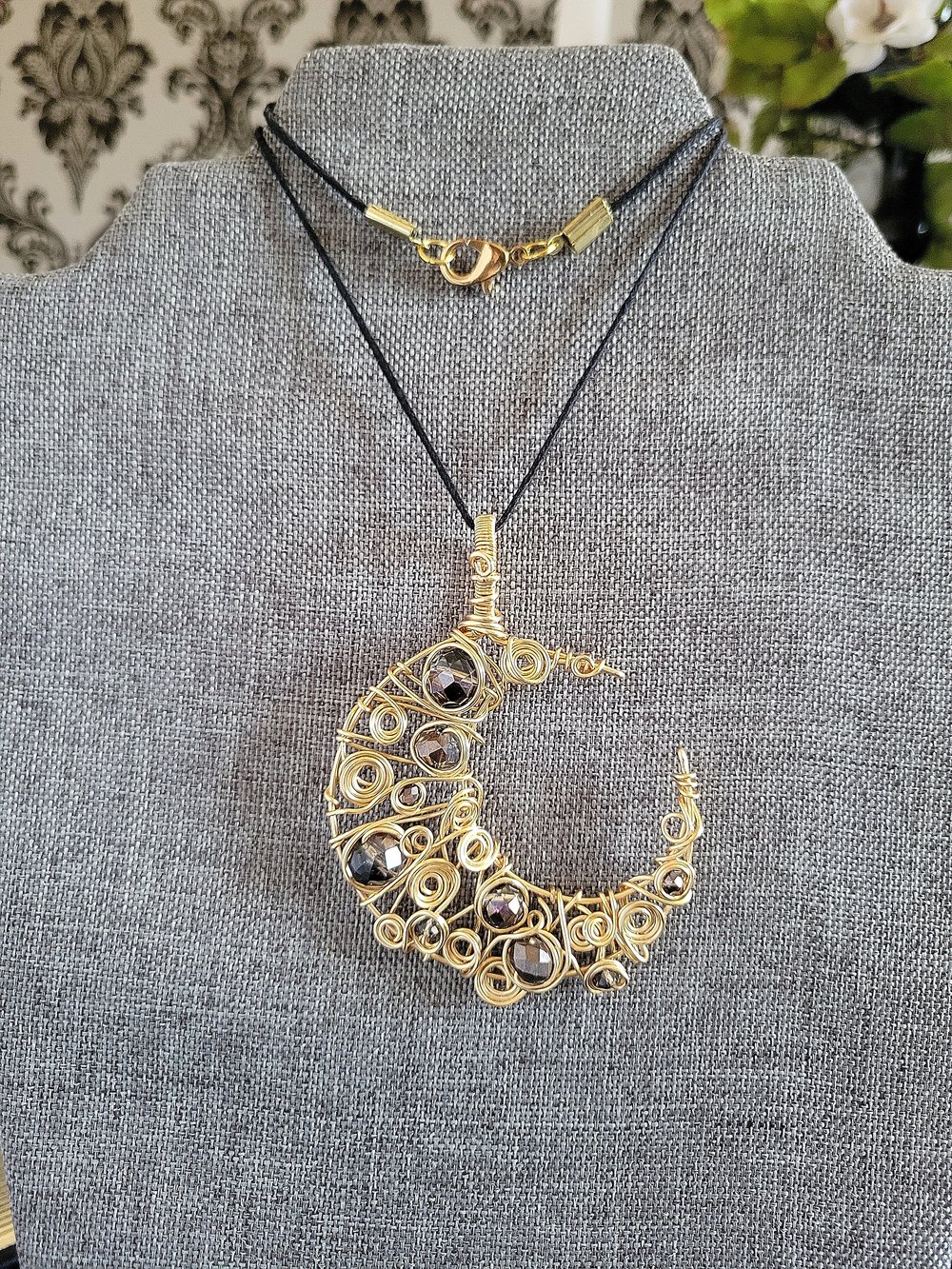 Image of Gold and Black Beaded Crescent Moon Pendant