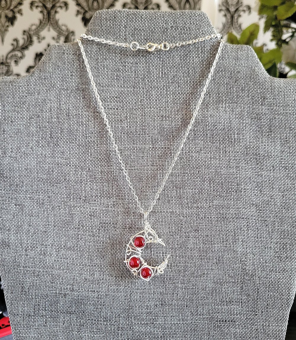 Image of Silver and Red Beaded Crescent Moon Necklace