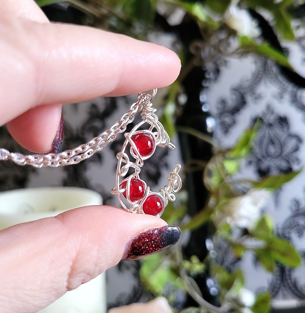 Image of Silver and Red Beaded Crescent Moon Necklace