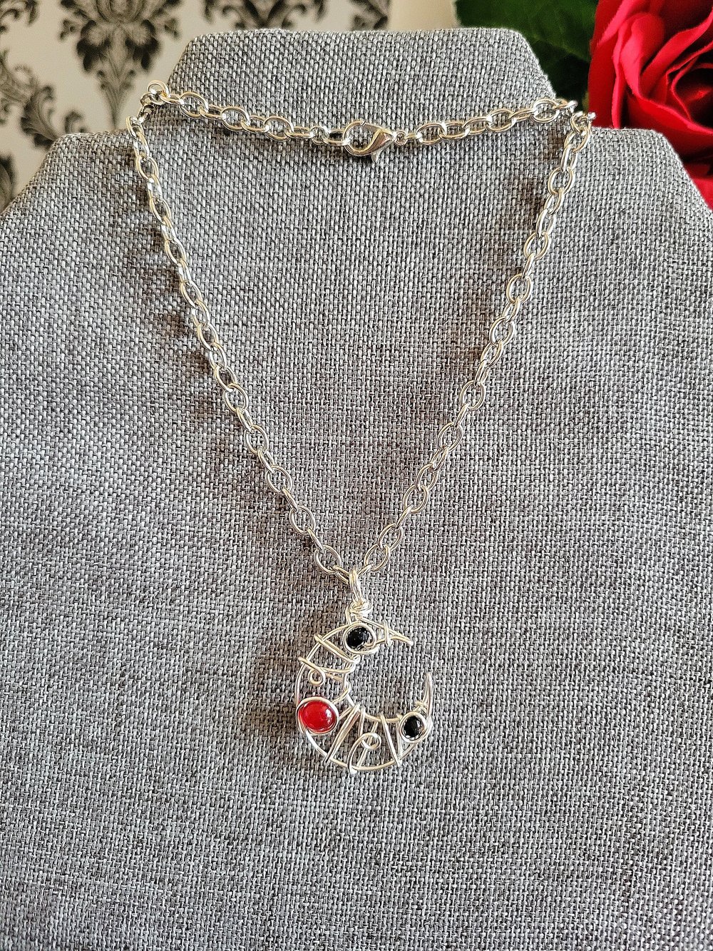 Image of Small Black and Red Beaded Crescent Moon Pendant Necklace