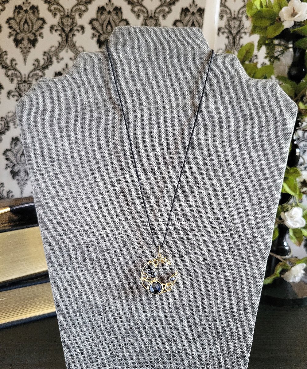 Image of Small Gold and Black Beaded Crescent Moon