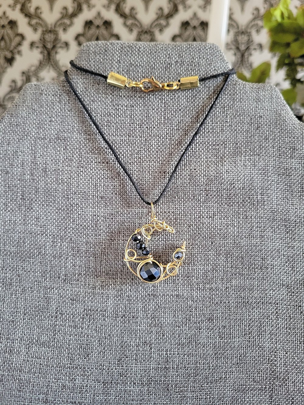 Image of Small Gold and Black Beaded Crescent Moon