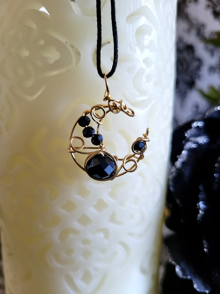Image of Small Gold and Black Beaded Crescent Moon