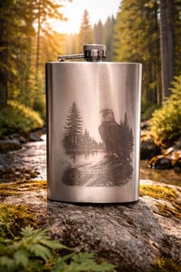 Eagle perched by river