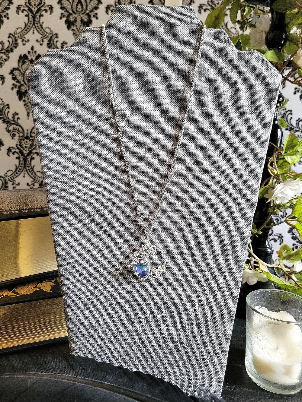 Image of Silver Crescent Moon Pendant Necklace with Glowing Blue Bead