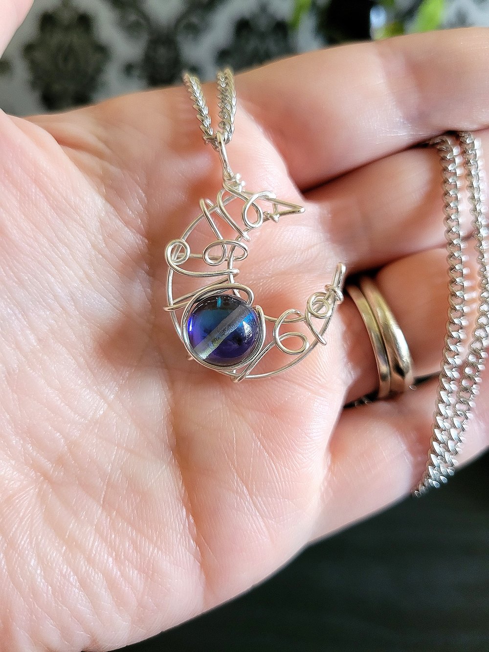 Image of Silver Crescent Moon Pendant Necklace with Glowing Blue Bead