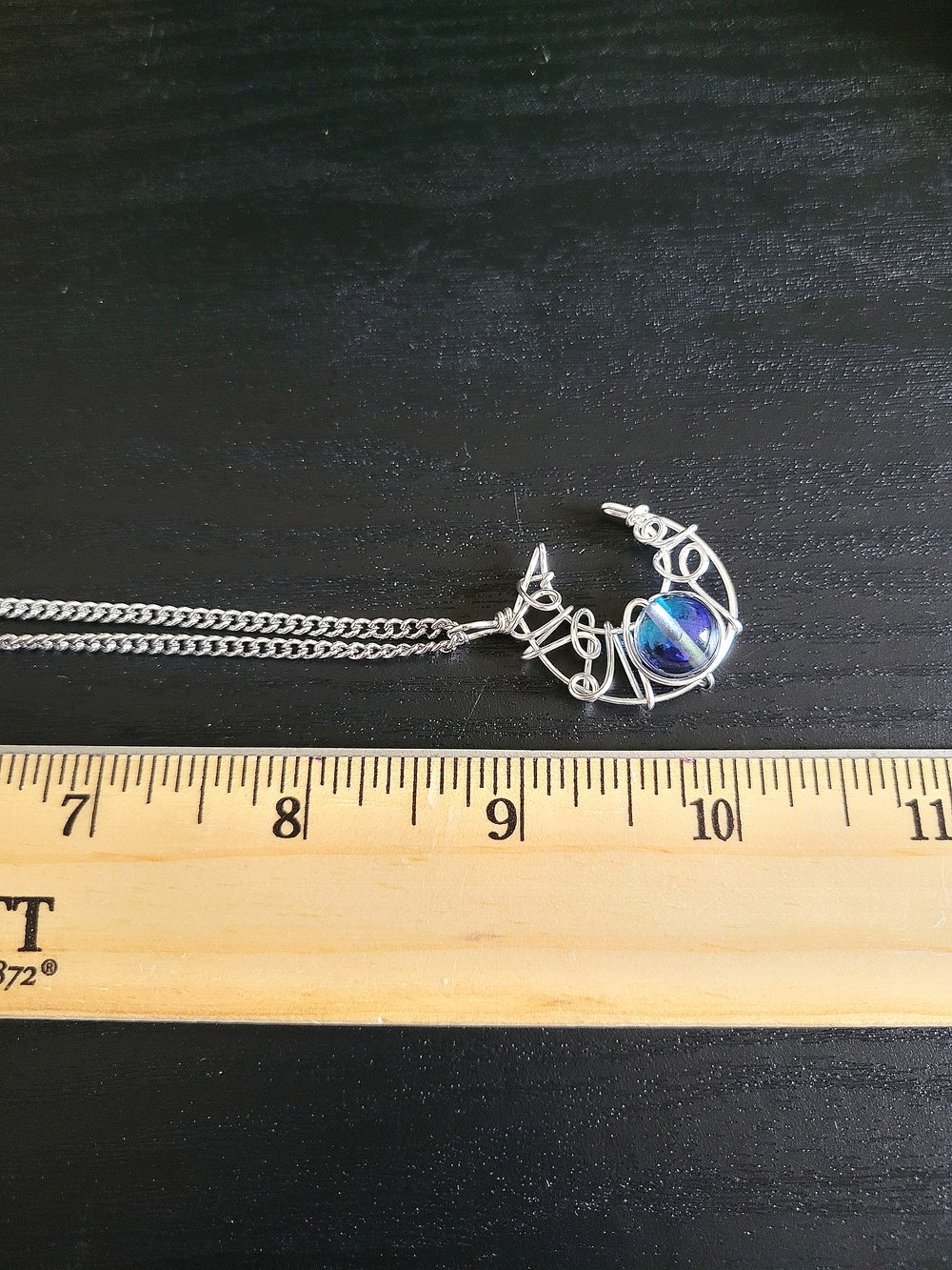 Image of Silver Crescent Moon Pendant Necklace with Glowing Blue Bead