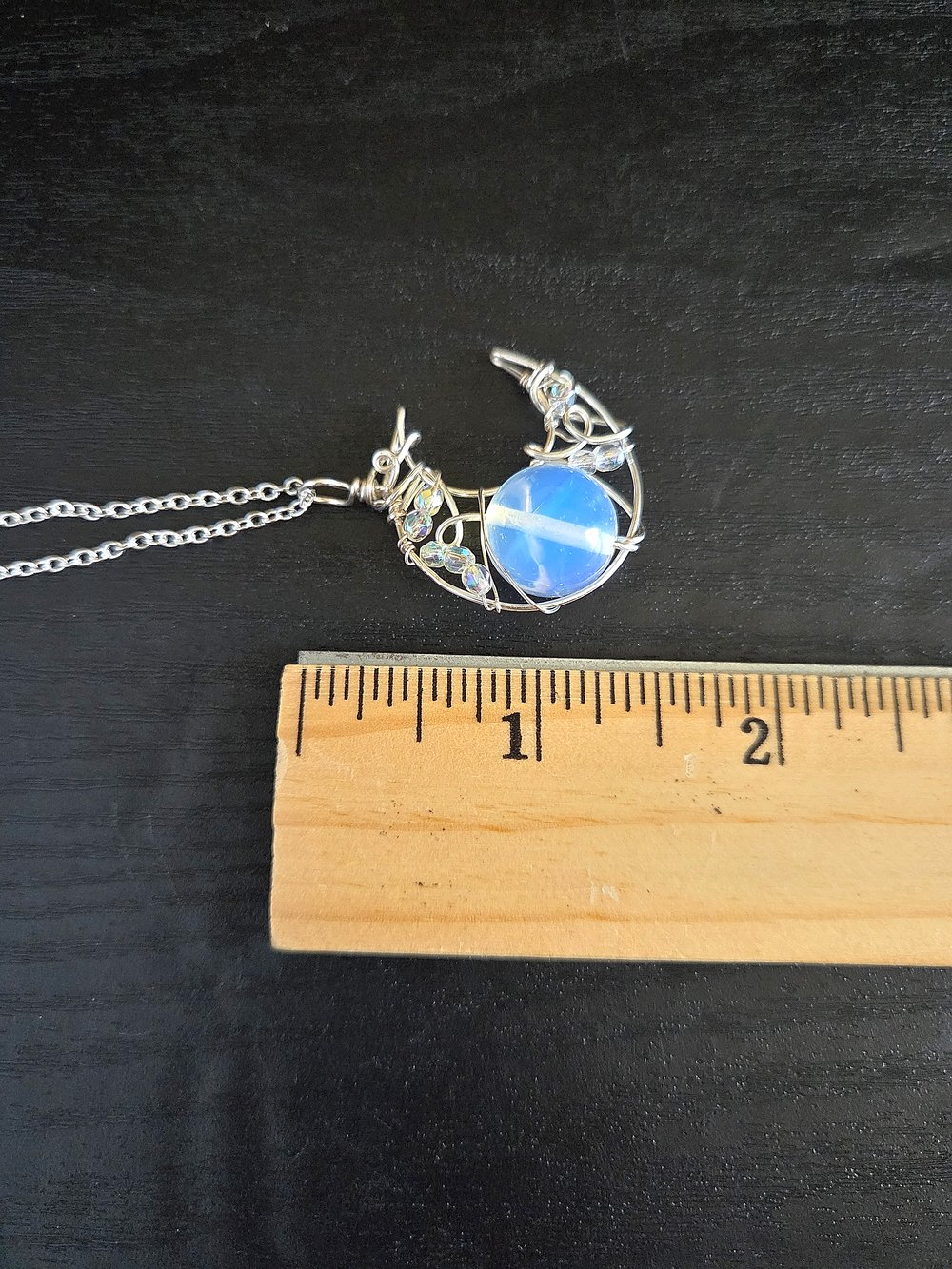 Image of Silver Crescent Moon Pendant with Opaque White Bead