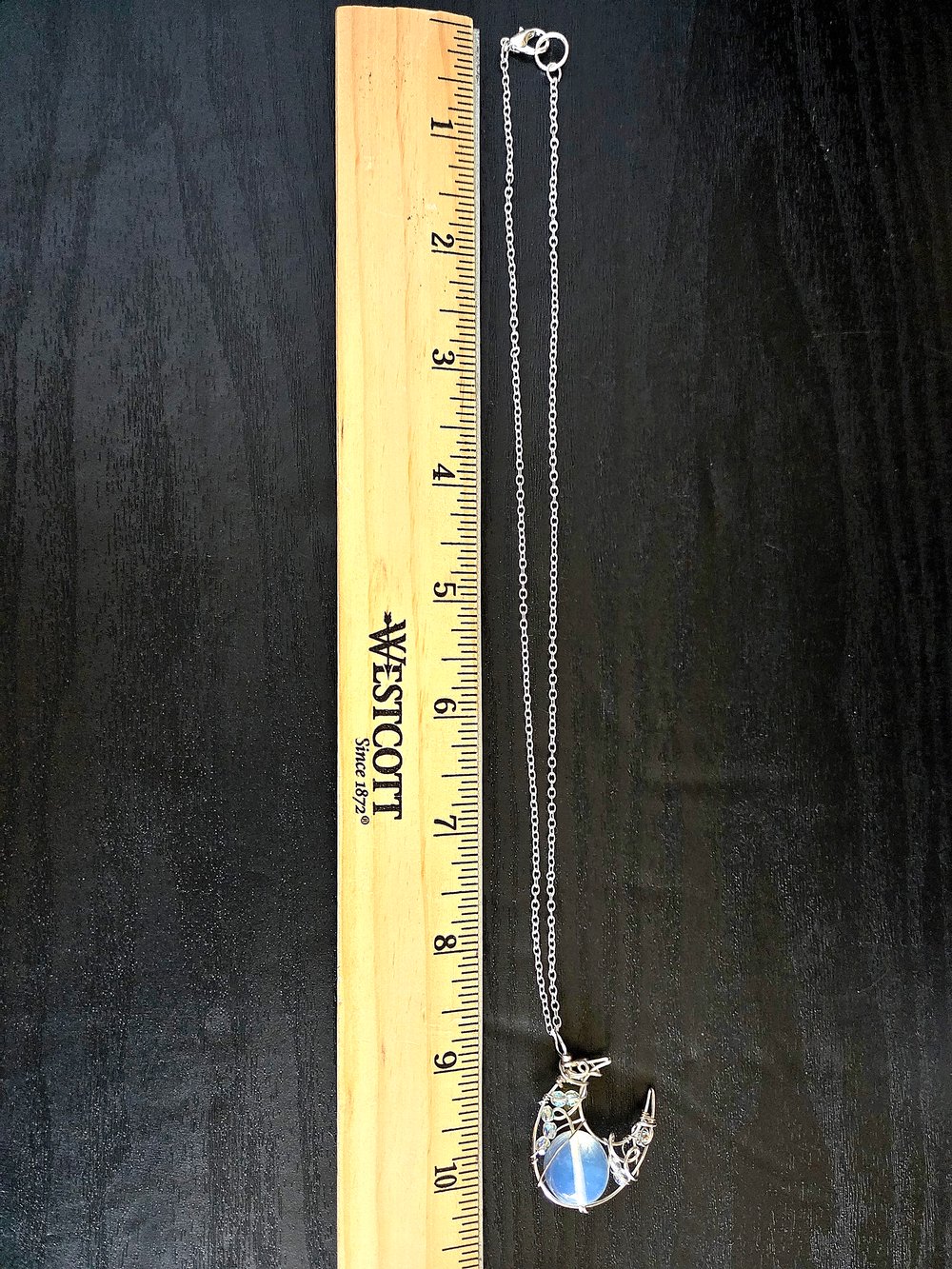 Image of Silver Crescent Moon Pendant with Opaque White Bead