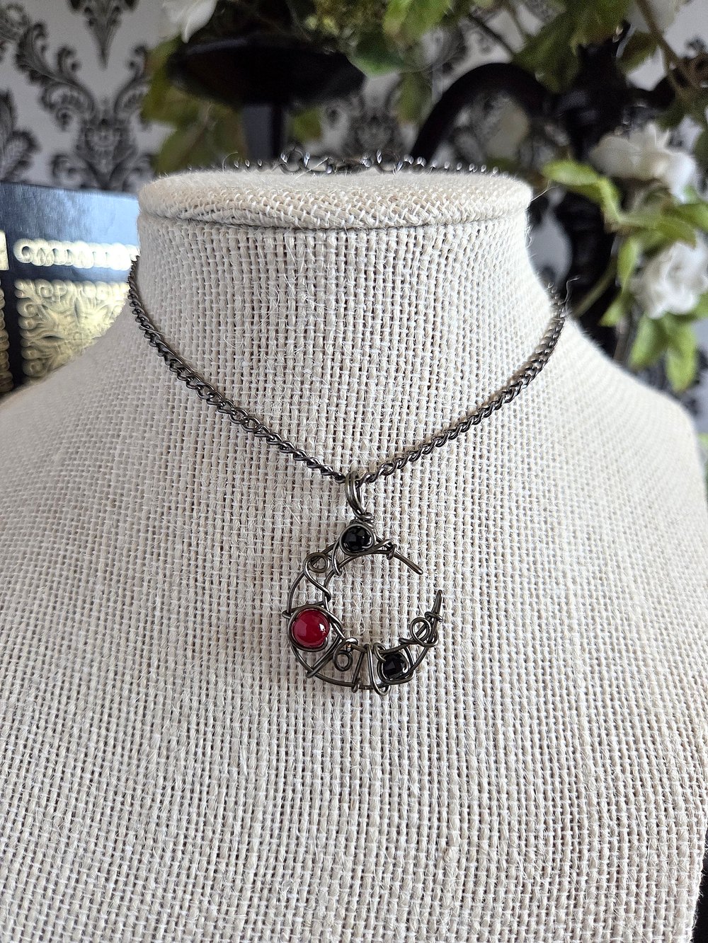Image of Small Black and Red Beaded Crescent Moon Gunmetal Pendant Necklace