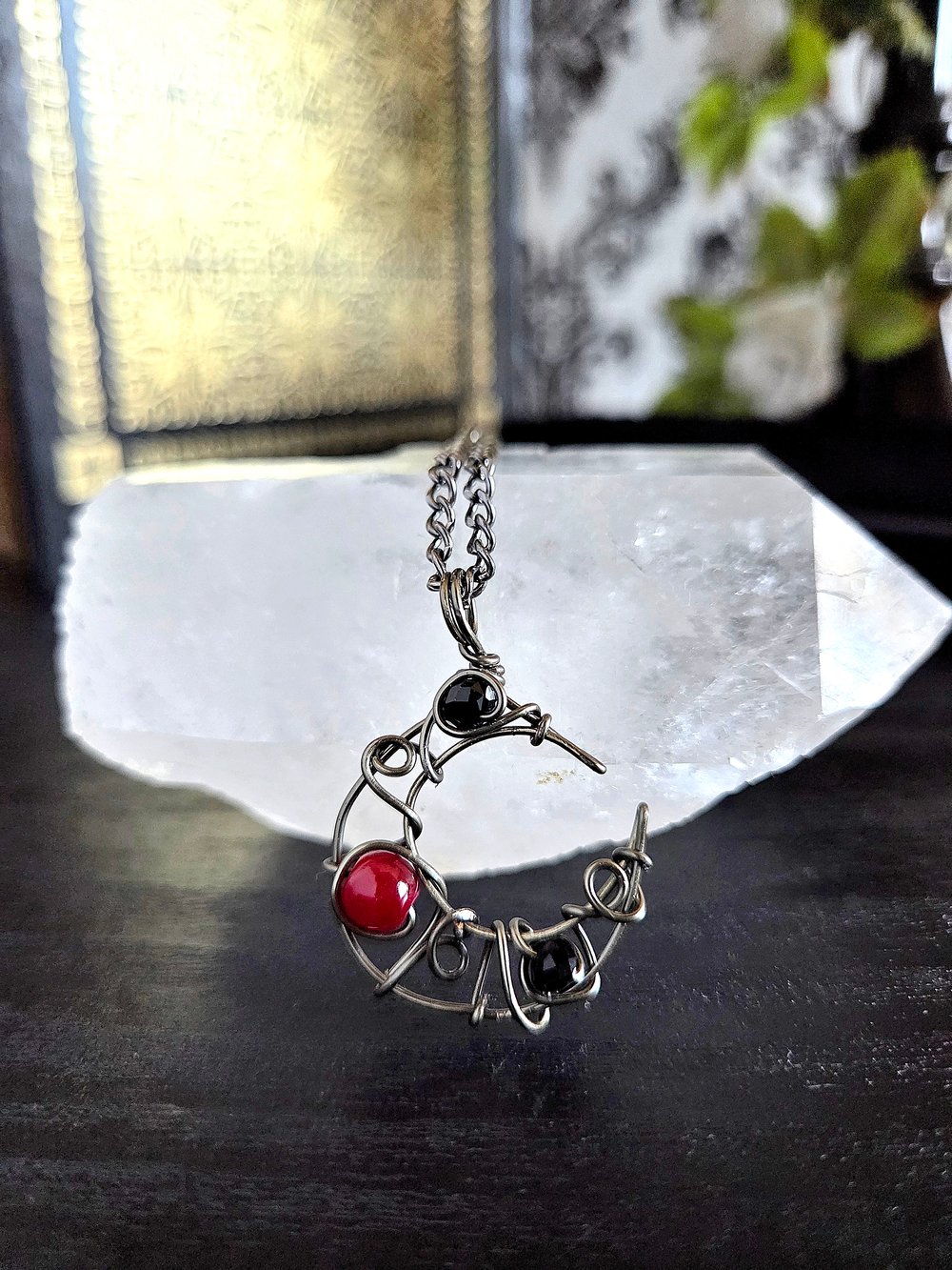 Image of Small Black and Red Beaded Crescent Moon Gunmetal Pendant Necklace