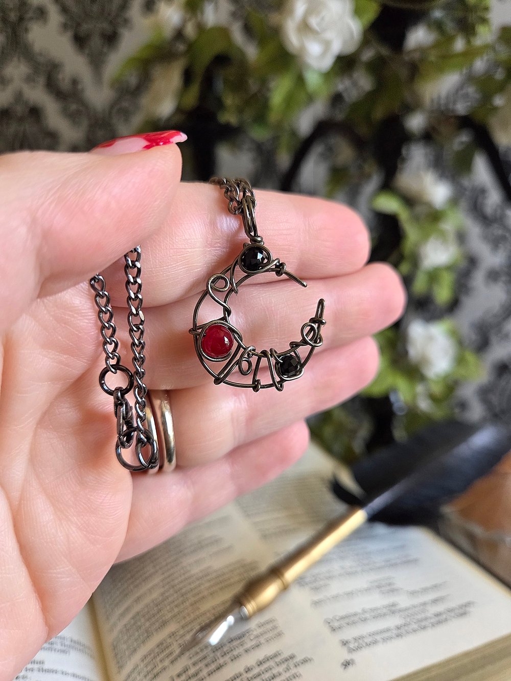 Image of Small Black and Red Beaded Crescent Moon Gunmetal Pendant Necklace