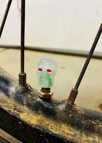 Image 2 of Glow in the dark Green Skull Valve Stem Caps