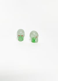 Image 1 of Glow in the dark Green Skull Valve Stem Caps
