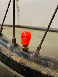 Image 2 of Orange Skull Valve Stem Caps