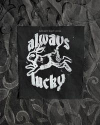 Image 2 of always lucky - original rabbit linocut patch