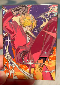 Image 1 of Black Leg TCG in hands 