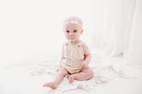Image 1 of Little Bow sitter romper 