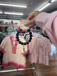 Image 2 of black wristlet keychain with gold accents