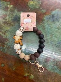 Image 1 of brown cow western wristlet keychain