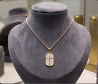 Image 1 of gold and white cross necklace